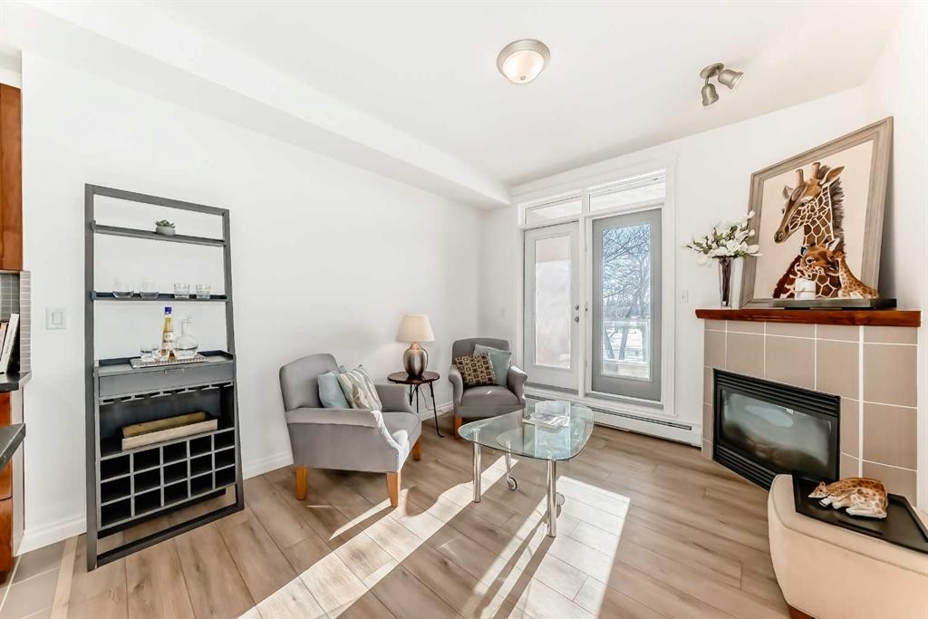 3217-24 Hemlock Crescent Sw, Calgary, AB - Indoor Photo Showing Living Room With Fireplace