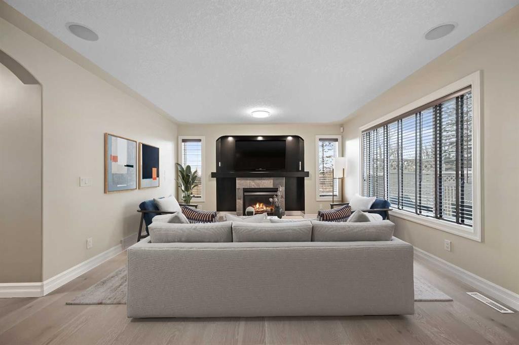 5619 Coach Hill Road Sw, Calgary, AB - Indoor Photo Showing Living Room With Fireplace