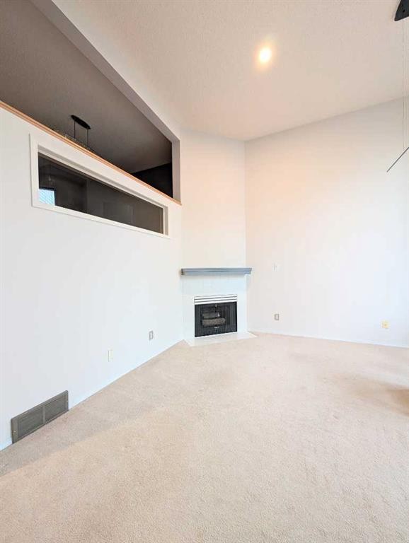 318 Hawkstone Manor Nw, Calgary, AB - Indoor With Fireplace