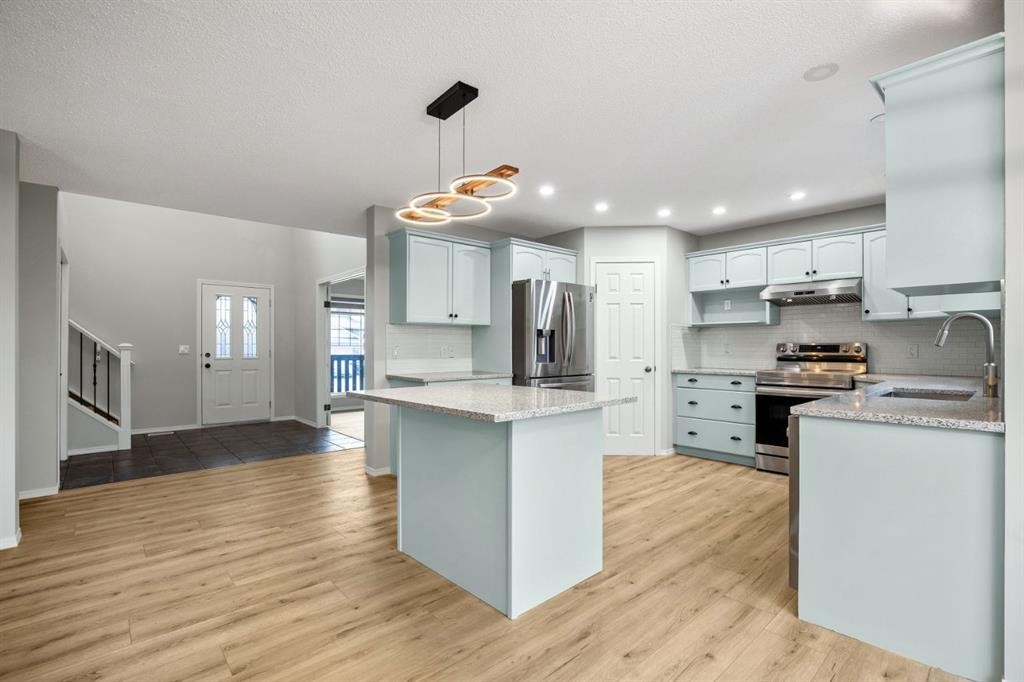 104 Cove Crescent, Chestermere, AB - Indoor Photo Showing Kitchen With Stainless Steel Kitchen With Upgraded Kitchen