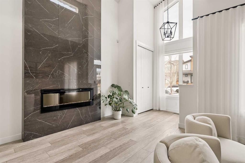 103 Haskayne Drive Nw, Calgary, AB - Indoor With Fireplace
