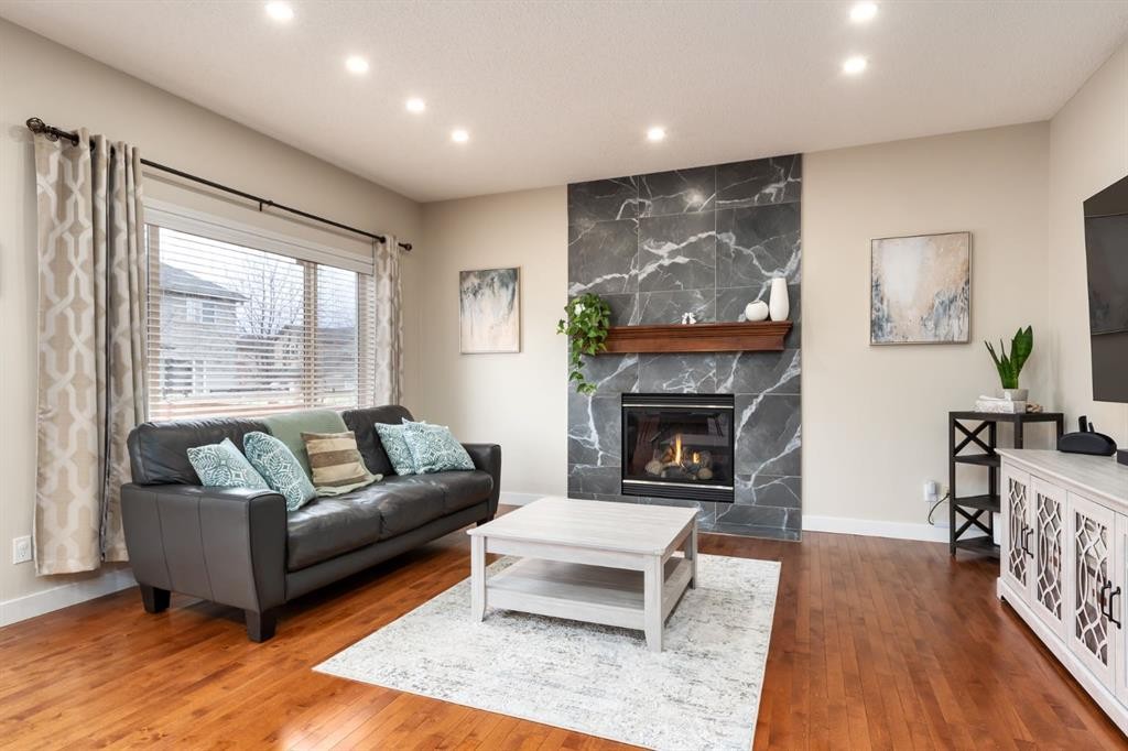 128 Seagreen Manor, Chestermere, AB - Indoor Photo Showing Living Room With Fireplace