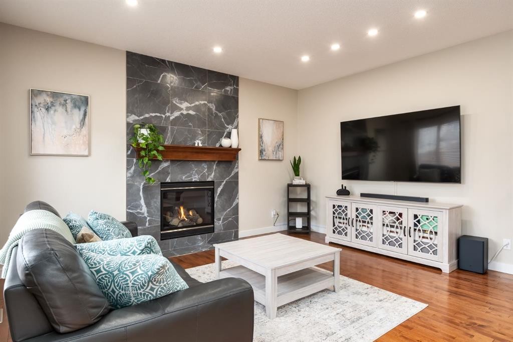 128 Seagreen Manor, Chestermere, AB - Indoor Photo Showing Living Room With Fireplace
