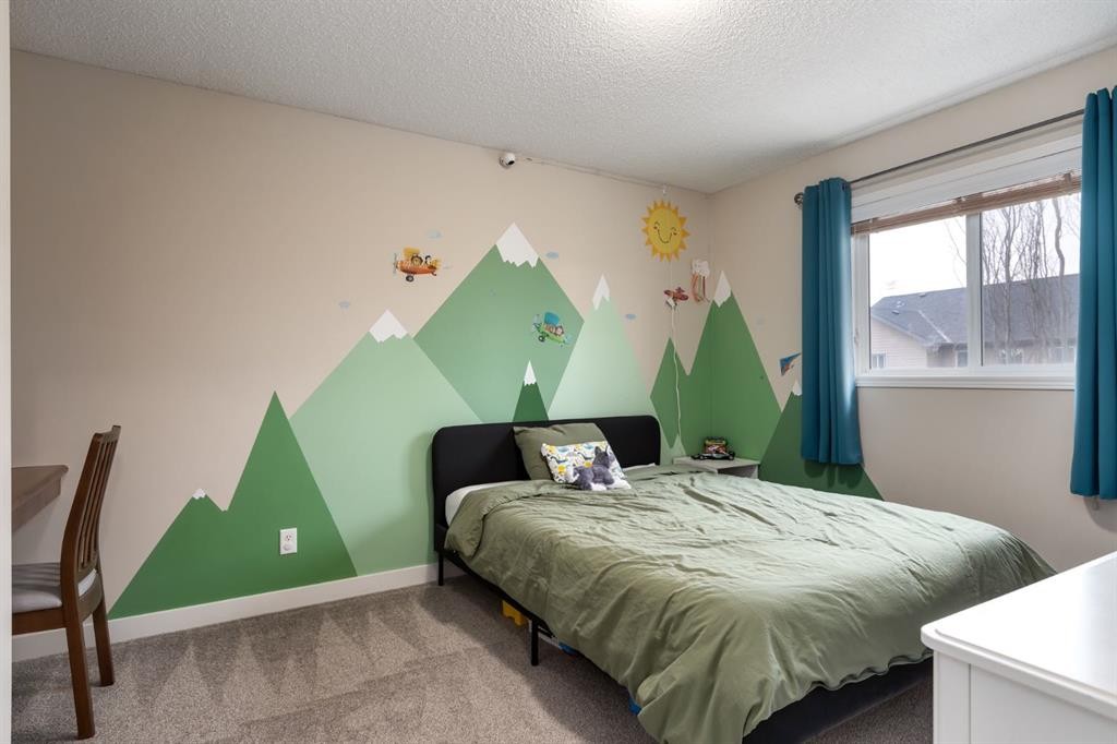 128 Seagreen Manor, Chestermere, AB - Indoor Photo Showing Bedroom