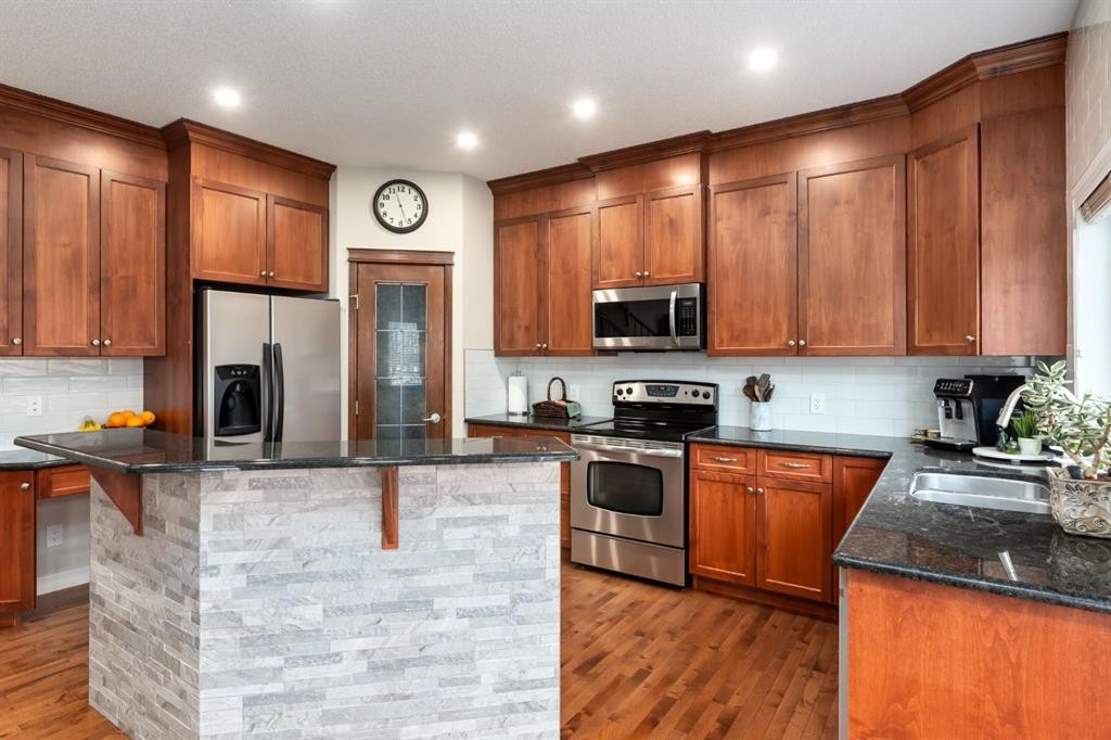 128 Seagreen Manor, Chestermere, AB - Indoor Photo Showing Kitchen With Double Sink