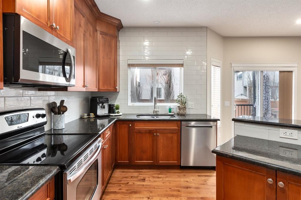 128 Seagreen Manor, Chestermere, AB - Indoor Photo Showing Kitchen With Double Sink