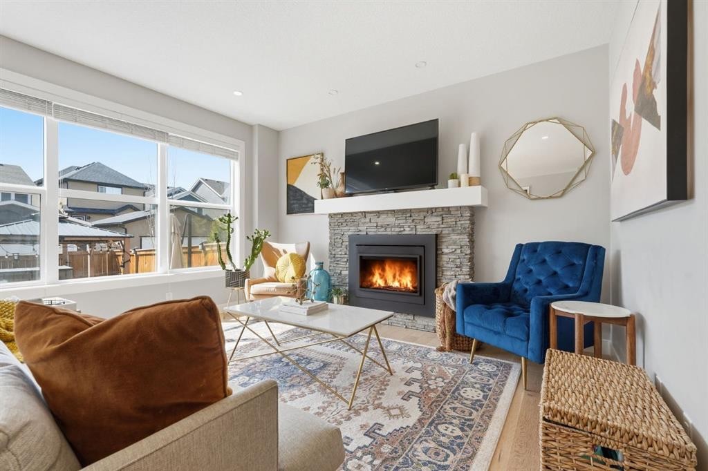 19 Masters Green Se, Calgary, AB - Indoor Photo Showing Living Room With Fireplace