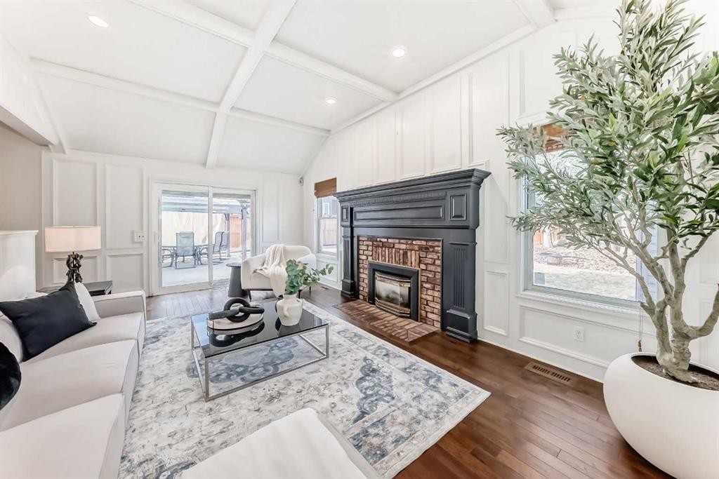 36 Stradbrooke Way Sw, Calgary, AB - Indoor Photo Showing Living Room With Fireplace