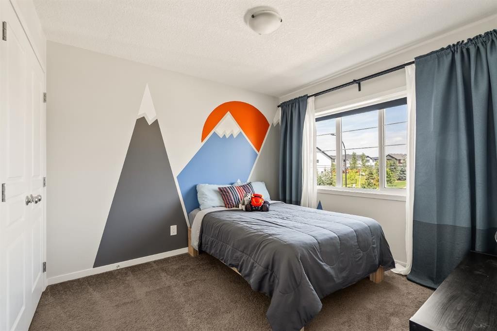 63 Seton Gardens Se, Calgary, AB - Indoor Photo Showing Bedroom