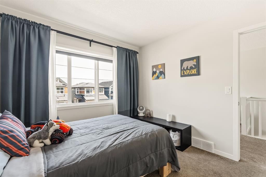 63 Seton Gardens Se, Calgary, AB - Indoor Photo Showing Bedroom