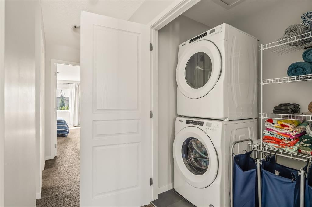 63 Seton Gardens Se, Calgary, AB - Indoor Photo Showing Laundry Room