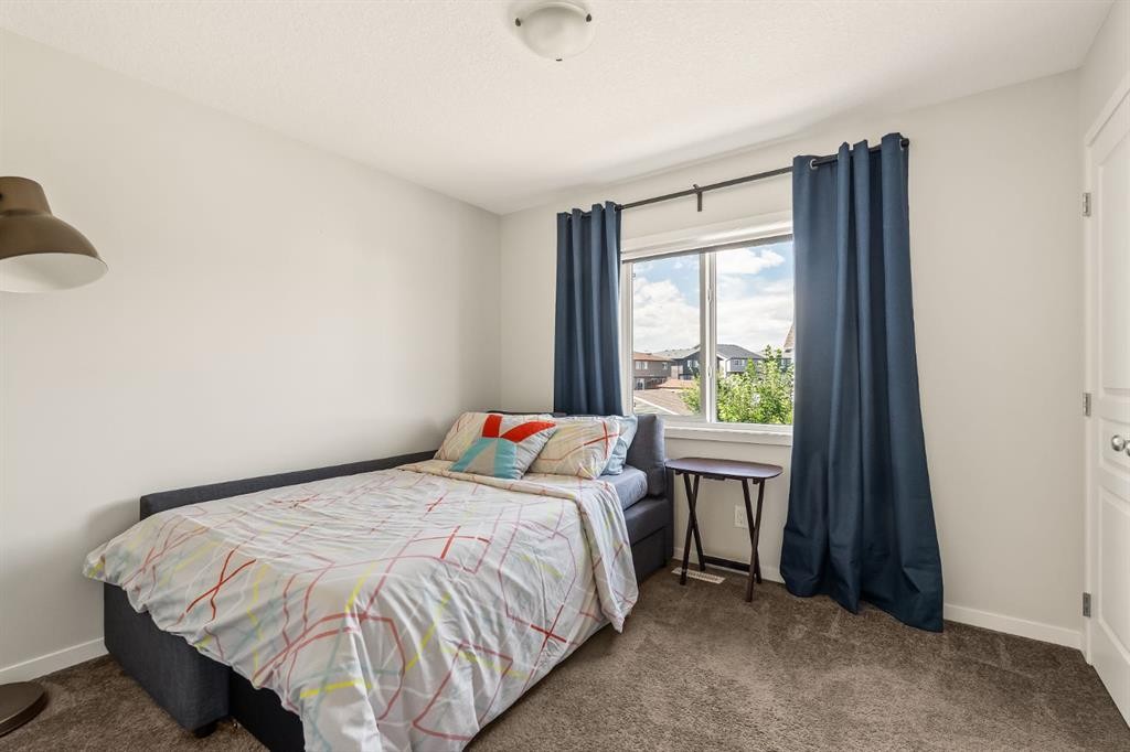 63 Seton Gardens Se, Calgary, AB - Indoor Photo Showing Bedroom