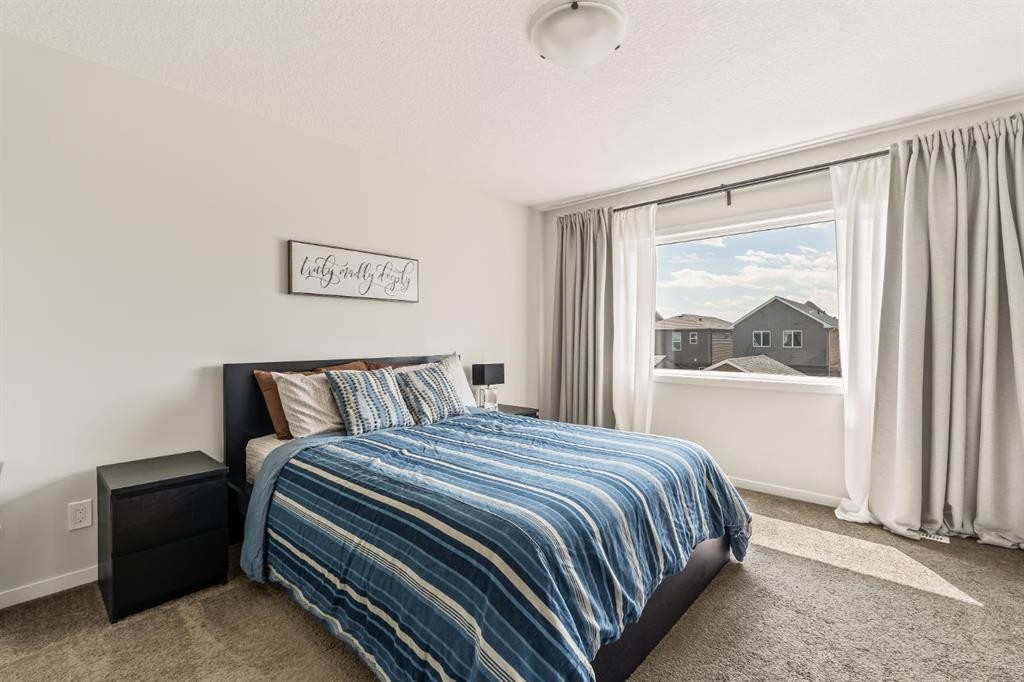 63 Seton Gardens Se, Calgary, AB - Indoor Photo Showing Bedroom