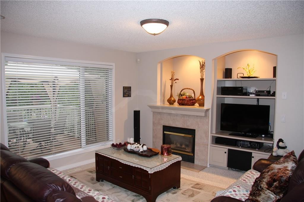 805 Panorama Hills Drive Nw, Calgary, AB - Indoor Photo Showing Living Room With Fireplace