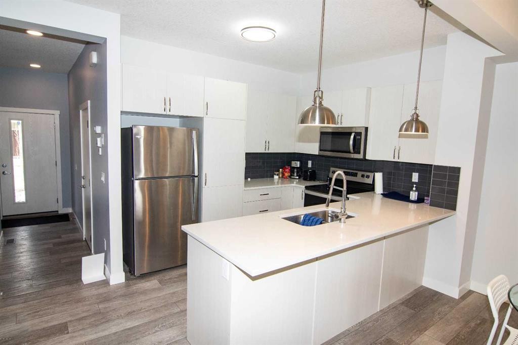 62 Walden Lane Se, Calgary, AB - Indoor Photo Showing Kitchen With Stainless Steel Kitchen With Upgraded Kitchen