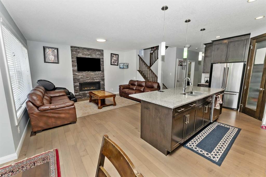 73 Redstone Link Ne, Calgary, AB - Indoor Photo Showing Kitchen With Fireplace With Stainless Steel Kitchen With Upgraded Kitchen