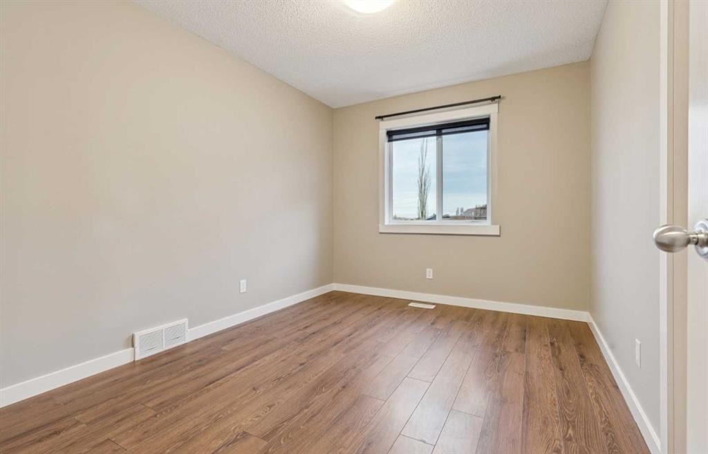 327 Panamount Point Nw, Calgary, AB - Indoor Photo Showing Other Room
