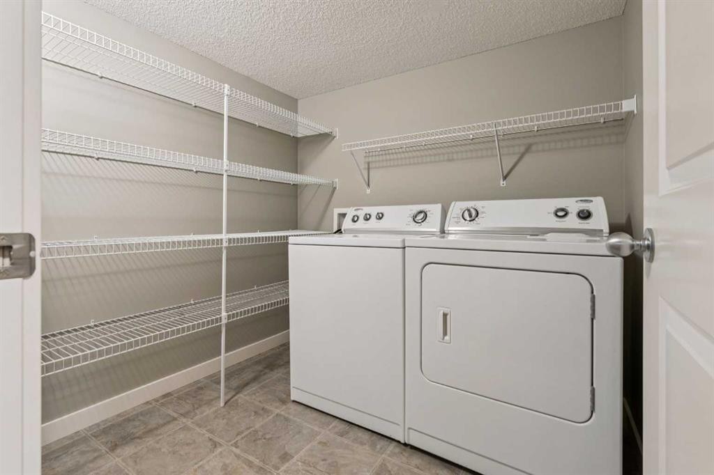 327 Panamount Point Nw, Calgary, AB - Indoor Photo Showing Laundry Room