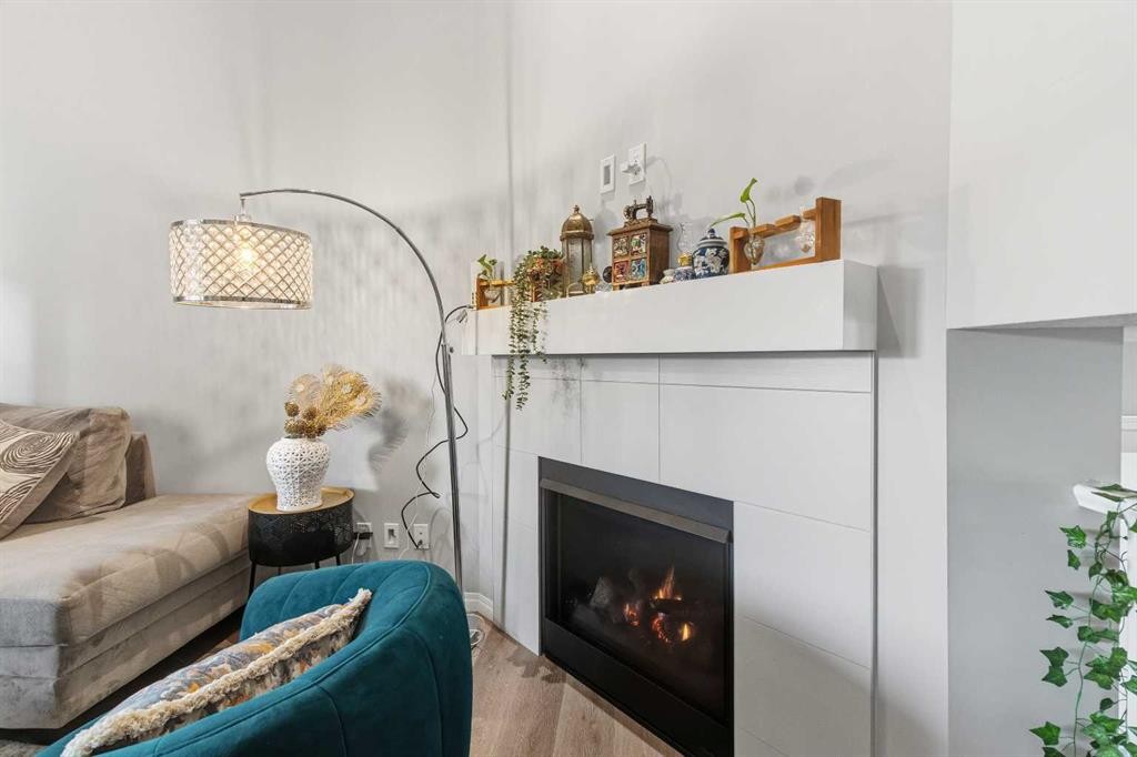 237 Windrow Crescent Sw, Airdrie, AB - Indoor Photo Showing Living Room With Fireplace