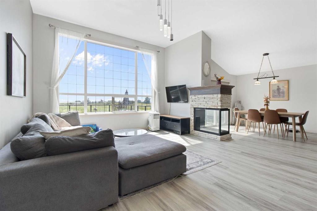 11 Muirfield Close, Lyalta, AB - Indoor Photo Showing Living Room With Fireplace