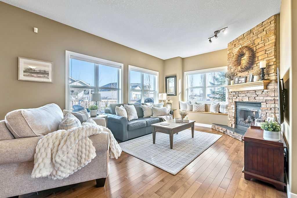 718 Hamptons Bay Se, High River, AB - Indoor Photo Showing Living Room With Fireplace