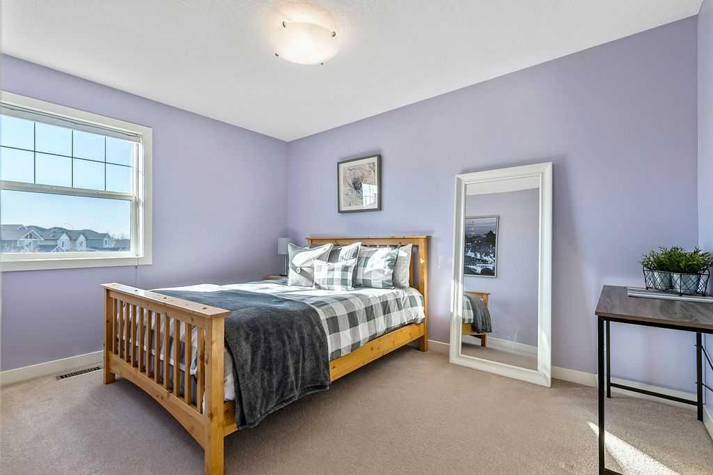 718 Hamptons Bay Se, High River, AB - Indoor Photo Showing Bedroom