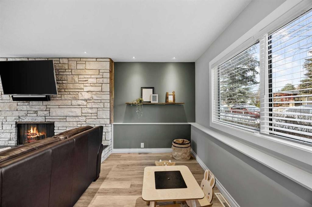 123 Sackville Drive Sw, Calgary, AB - Indoor Photo Showing Other Room With Fireplace
