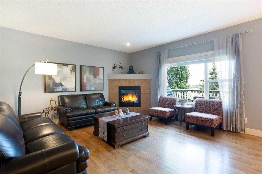 62 Panamount Road Nw, Calgary, AB - Indoor Photo Showing Living Room With Fireplace