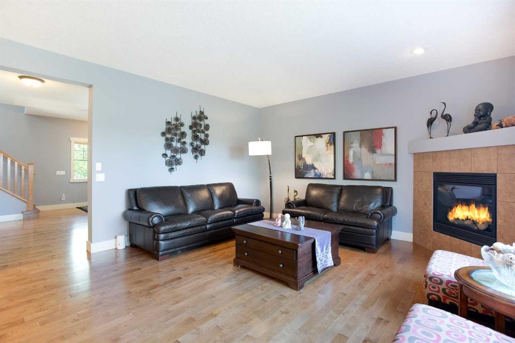 62 Panamount Road Nw, Calgary, AB - Indoor Photo Showing Living Room With Fireplace