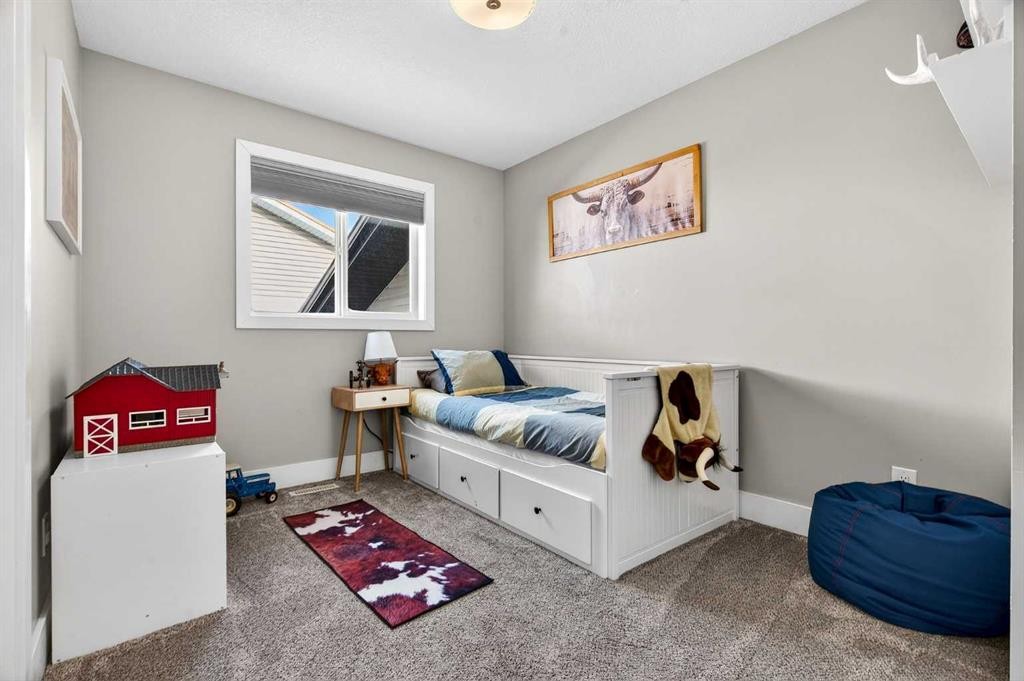 951 3Rd Street Sw, Diamond Valley, AB - Indoor Photo Showing Bedroom