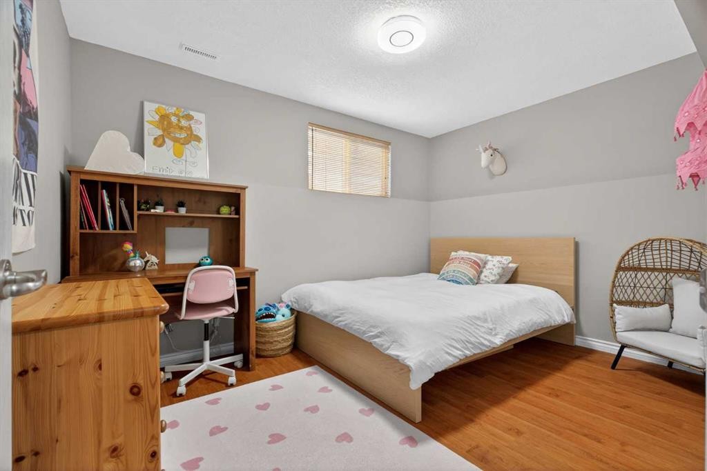 951 3Rd Street Sw, Diamond Valley, AB - Indoor Photo Showing Bedroom