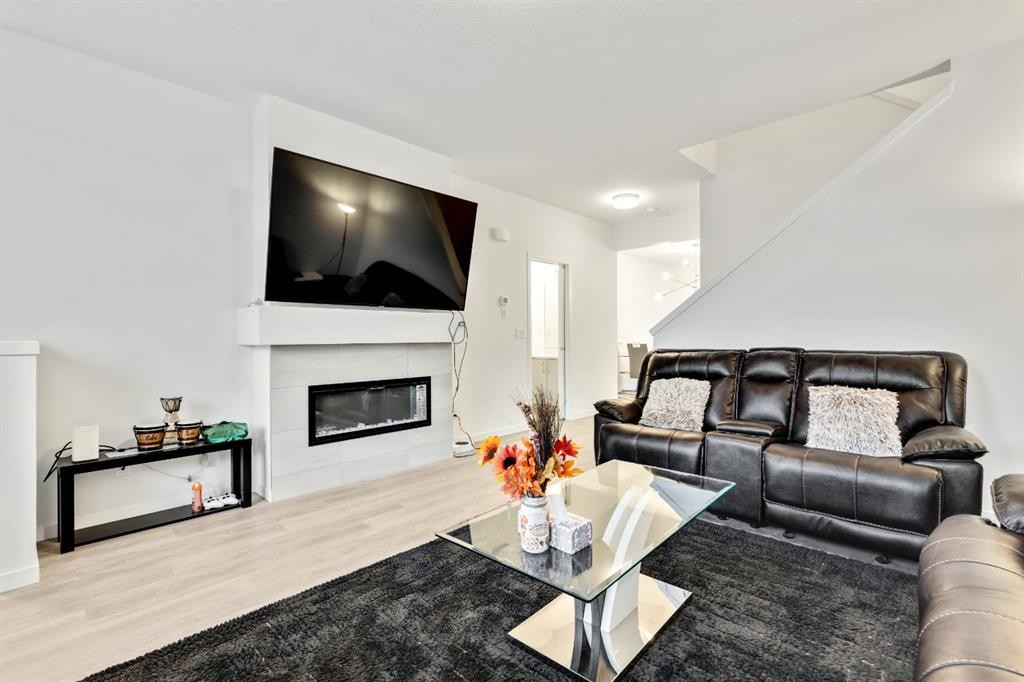 620 Copperstone Manor Se, Calgary, AB - Indoor Photo Showing Living Room With Fireplace