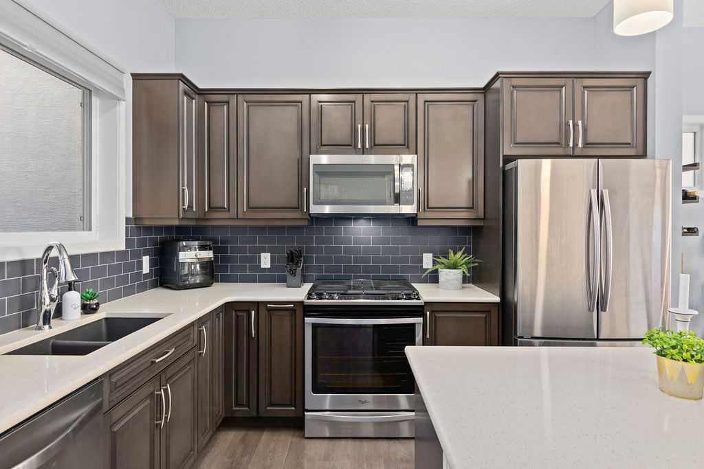103 Masters Heights Se, Calgary, AB - Indoor Photo Showing Kitchen With Double Sink With Upgraded Kitchen