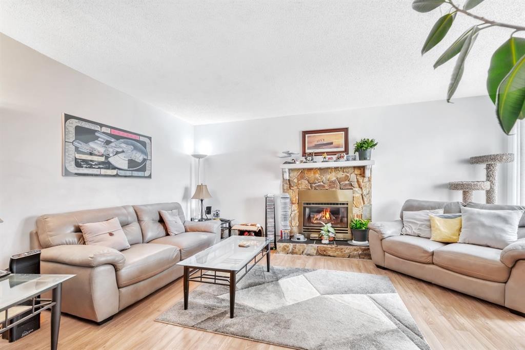 5 Falsby Place Ne, Calgary, AB - Indoor Photo Showing Living Room With Fireplace