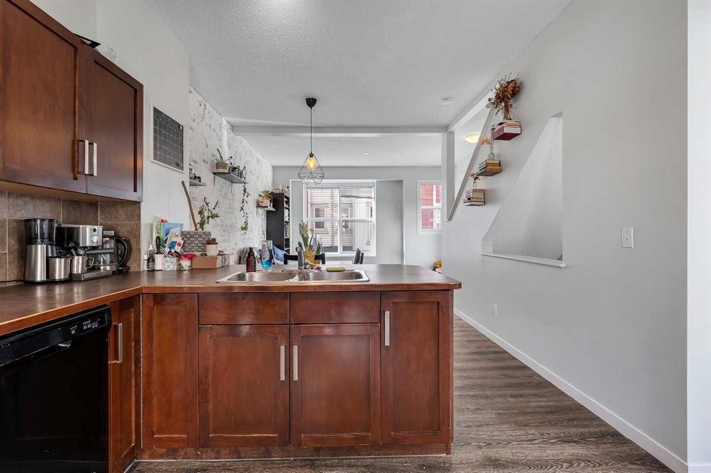 149 New Brighton Point Se, Calgary, AB - Indoor Photo Showing Kitchen With Double Sink