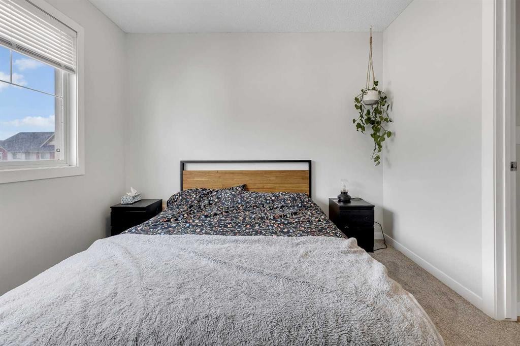 149 New Brighton Point Se, Calgary, AB - Indoor Photo Showing Bedroom