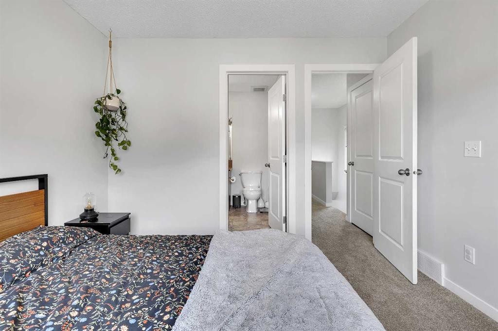 149 New Brighton Point Se, Calgary, AB - Indoor Photo Showing Bedroom