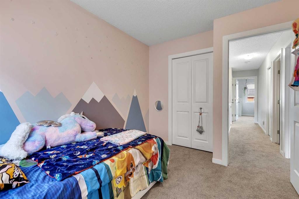 149 New Brighton Point Se, Calgary, AB - Indoor Photo Showing Bedroom