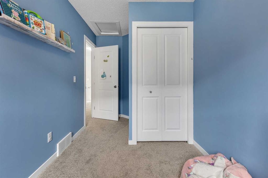 149 New Brighton Point Se, Calgary, AB - Indoor Photo Showing Bedroom