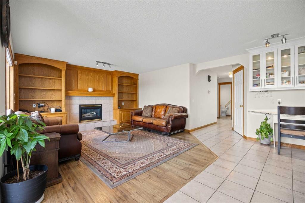 220 Edgeridge Gardens Nw, Calgary, AB - Indoor Photo Showing Living Room With Fireplace