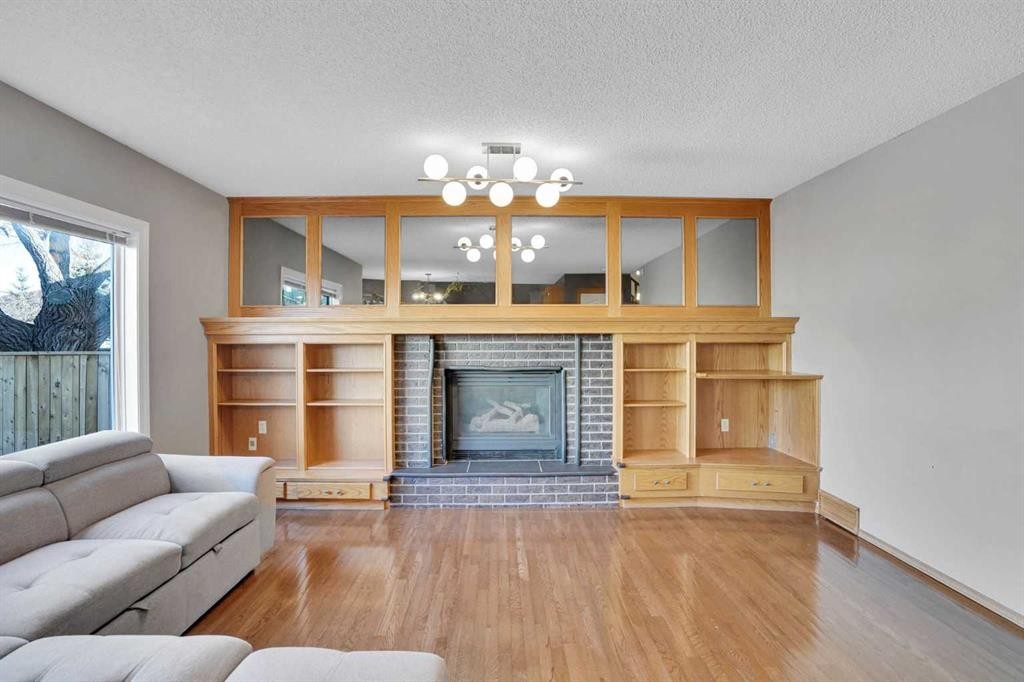 157 Riverview Park, Calgary, AB - Indoor Photo Showing Living Room With Fireplace