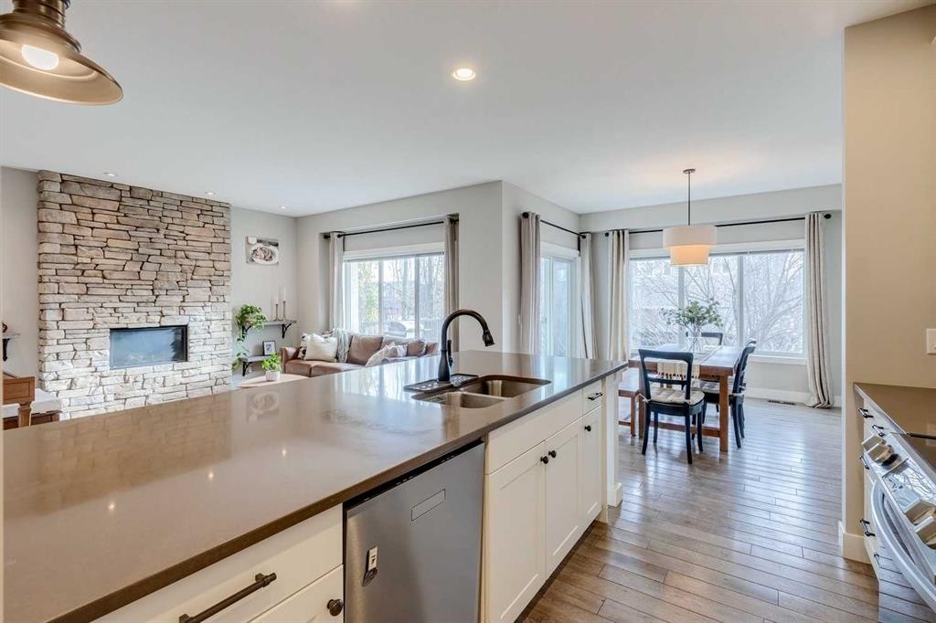 75 Masters Rise Se, Calgary, AB - Indoor Photo Showing Kitchen With Fireplace With Double Sink