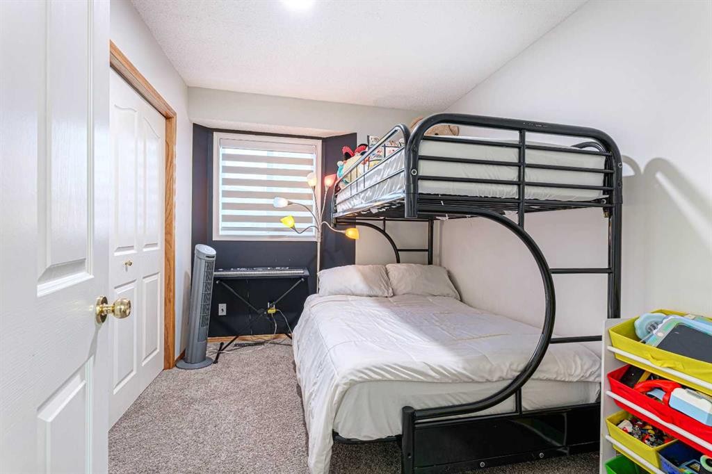 13 Mt. Aberdeen Manor Se, Calgary, AB - Indoor Photo Showing Bedroom