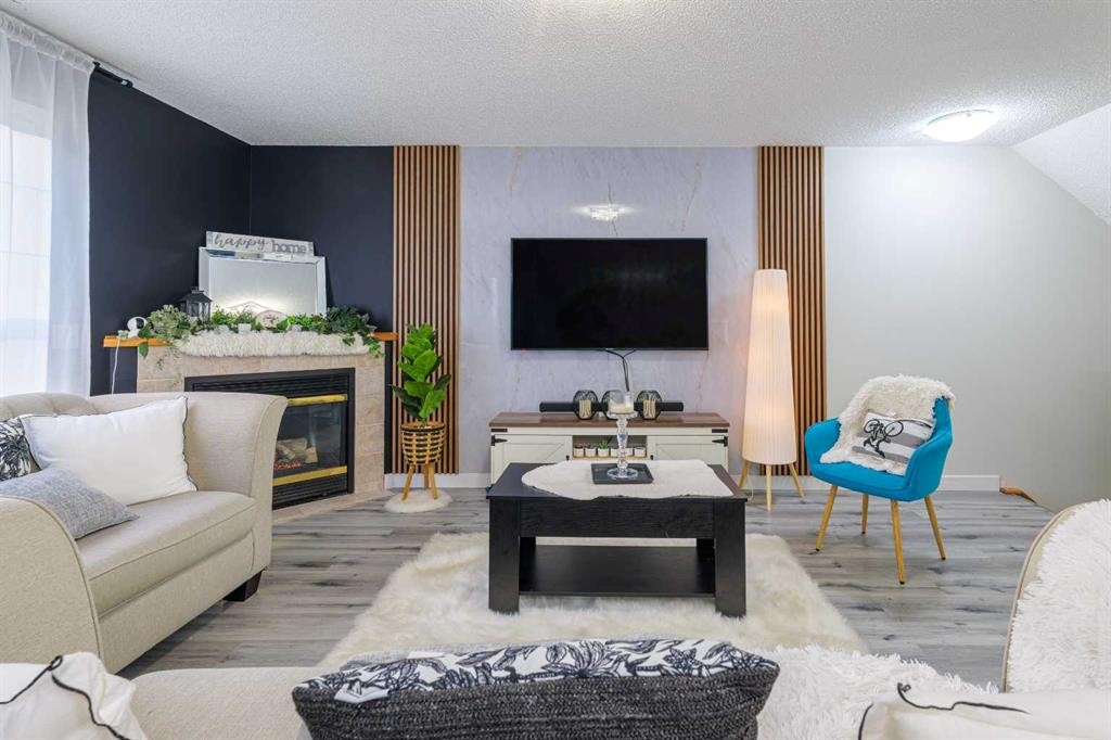 13 Mt. Aberdeen Manor Se, Calgary, AB - Indoor Photo Showing Living Room With Fireplace