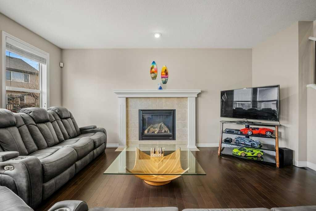 103 Panamount Common Nw, Calgary, AB - Indoor Photo Showing Living Room With Fireplace