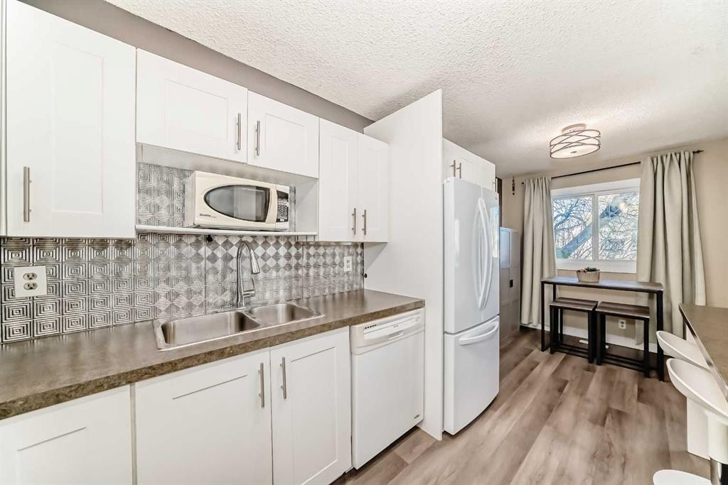 1013 Marcombe Crescent Ne, Calgary, AB - Indoor Photo Showing Kitchen With Double Sink