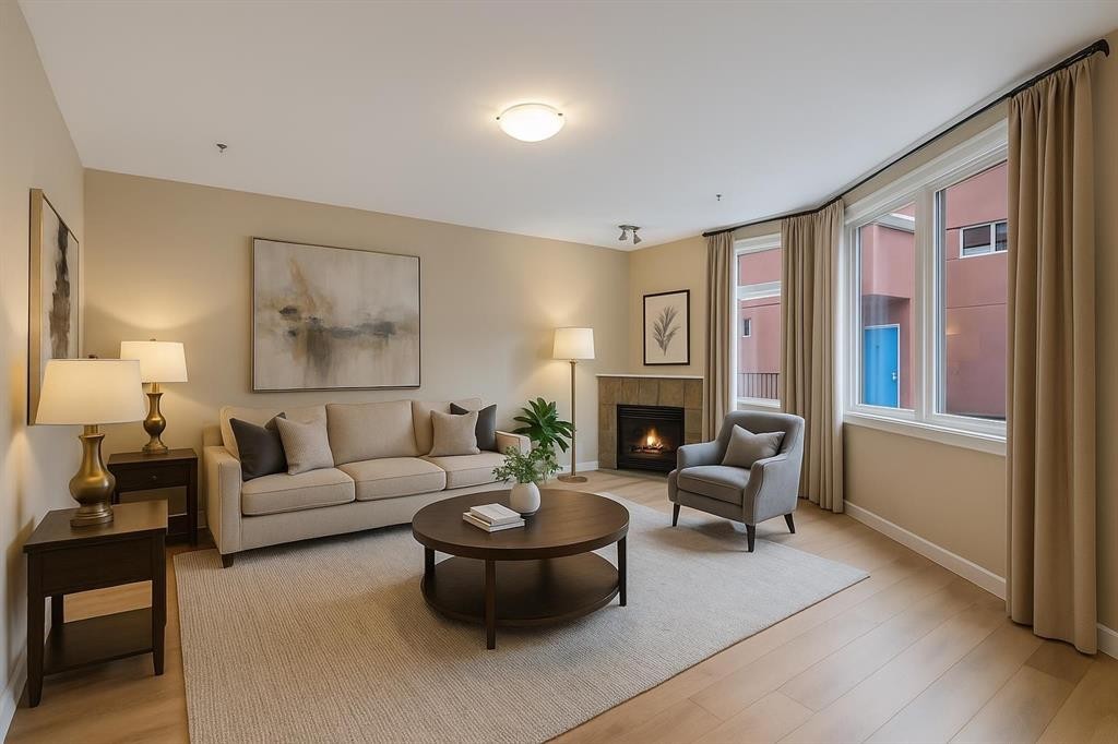 403-718 5 Street Ne, Calgary, AB - Indoor Photo Showing Living Room With Fireplace