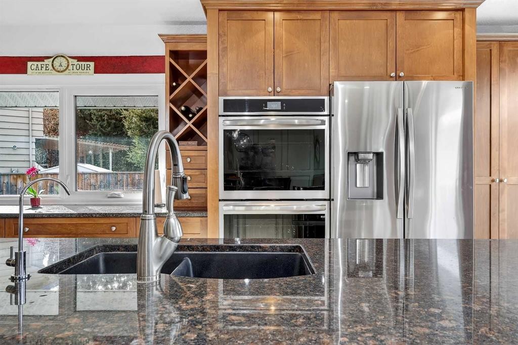 80 Oakmount Way Sw, Calgary, AB - Indoor Photo Showing Kitchen With Stainless Steel Kitchen With Double Sink With Upgraded Kitchen