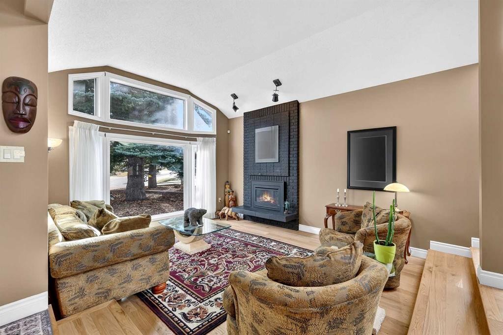 80 Oakmount Way Sw, Calgary, AB - Indoor Photo Showing Living Room With Fireplace