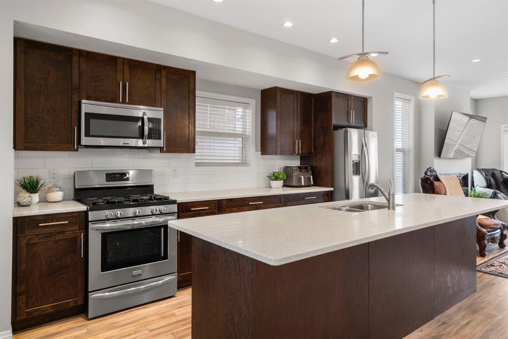 2001-280 Williamstown Close Nw, Airdrie, AB - Indoor Photo Showing Kitchen With Stainless Steel Kitchen With Double Sink With Upgraded Kitchen